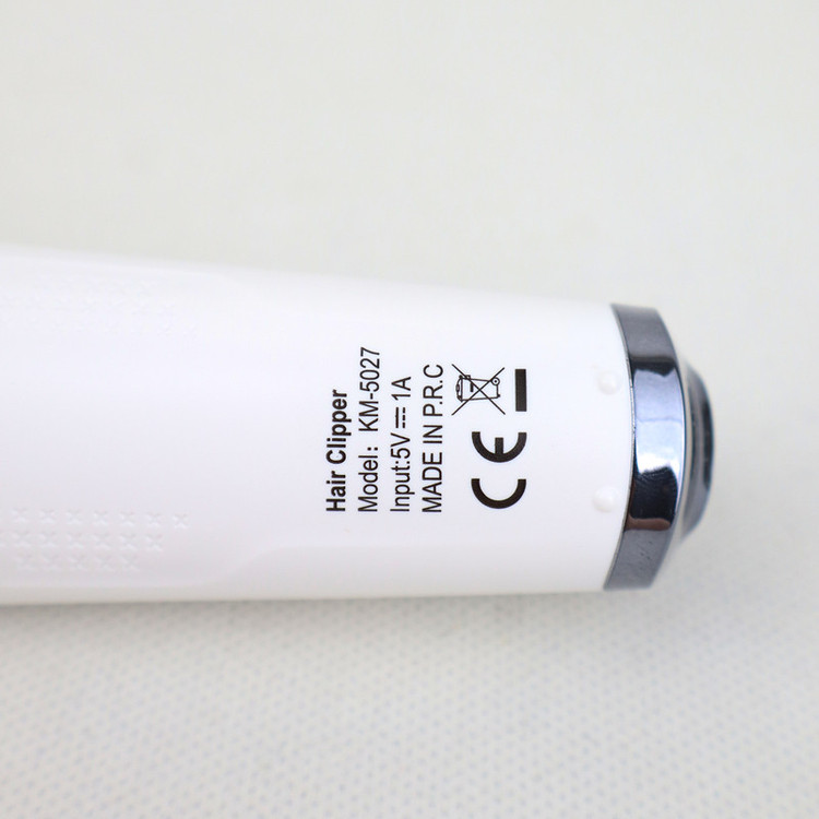ماشین اصلاح موی سر و صورت کیمی مدل KM-5027 Professional با تیغه تیتانیوم پیشرفته، باتری لیتیوم یون 1400 میلیآمپر، شارژ تایپسی، طراحی ارگونومیک و قابلیت استفاده خشک و مرطوب