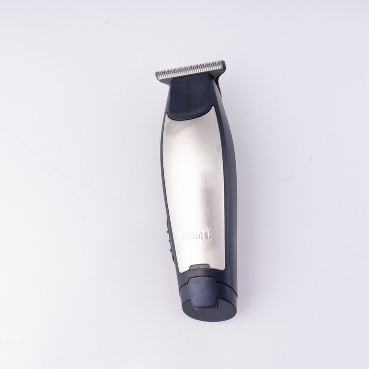 ماشین اصلاح موی سر و صورت کیمی مدل NEW km-5021 با تیغه استیل ضد زنگ، باتری 600 میلیآمپر، شارژ 60 دقیقه، زمان استفاده 90 دقیقه، توان 5 وات، اصلاح صفر زن و خط زن، همراه با 3 شانه سایز 1، 2 و 3 میلیمتر